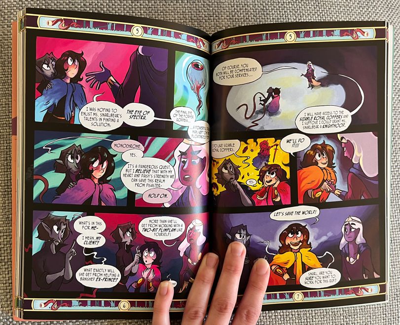 Photo: a printed comic book, held open by a hand